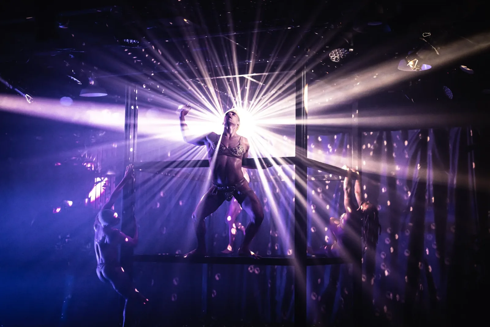 Production photograph — theatrical lighting and scenic design by Oona Curley