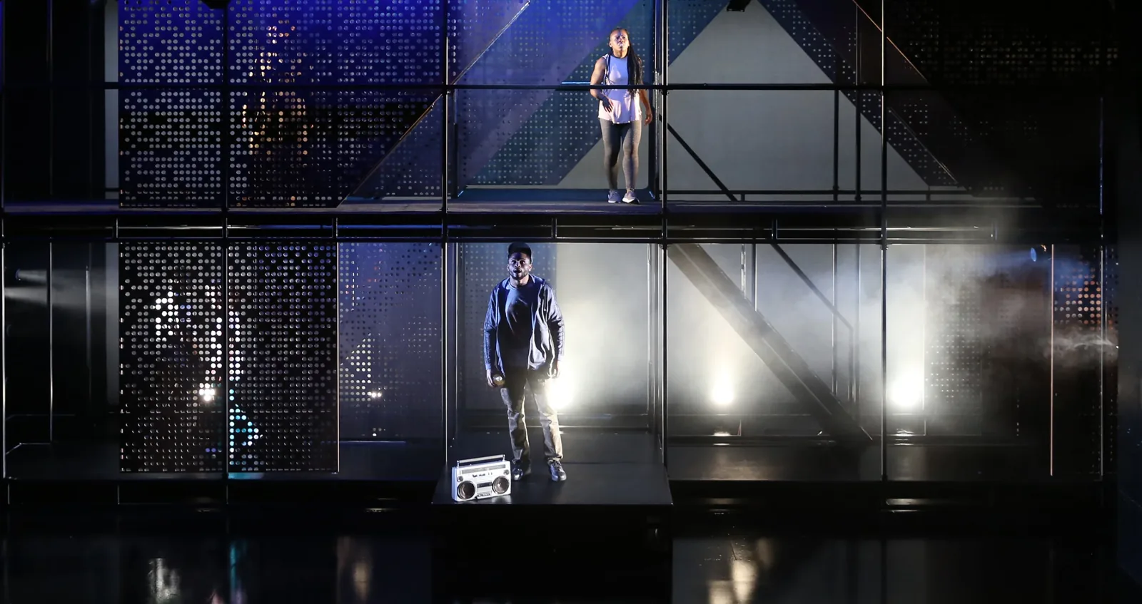 Production photograph — theatrical lighting and scenic design by Oona Curley