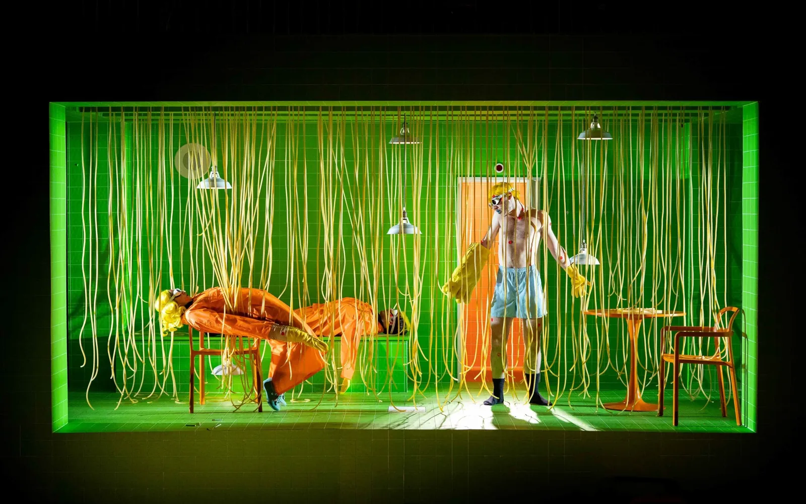Production photograph — theatrical lighting and scenic design by Oona Curley