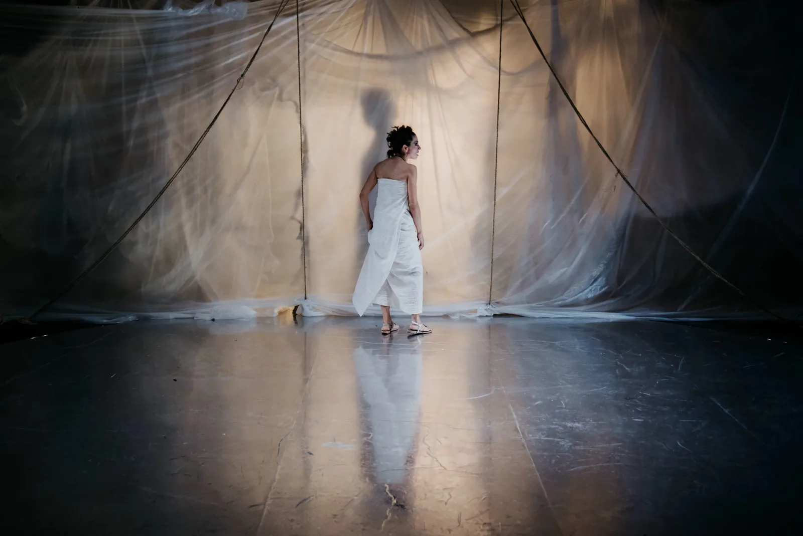 Production photograph — theatrical lighting and scenic design by Oona Curley