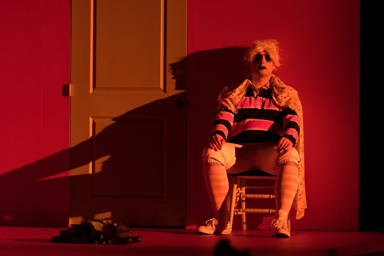 Production photograph — theatrical lighting and scenic design by Oona Curley