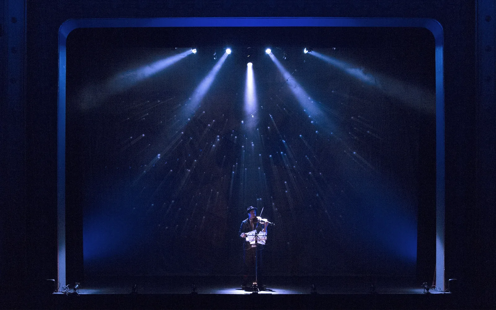 Production photograph — theatrical lighting and scenic design by Oona Curley