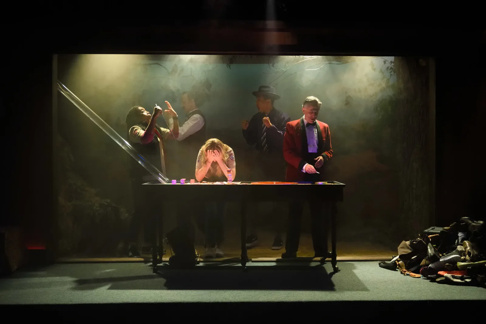 Production photograph — theatrical lighting and scenic design by Oona Curley